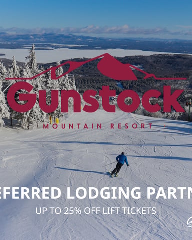 Skier at Gunstock Mountain Resort with views of Lake Winnipesaukee